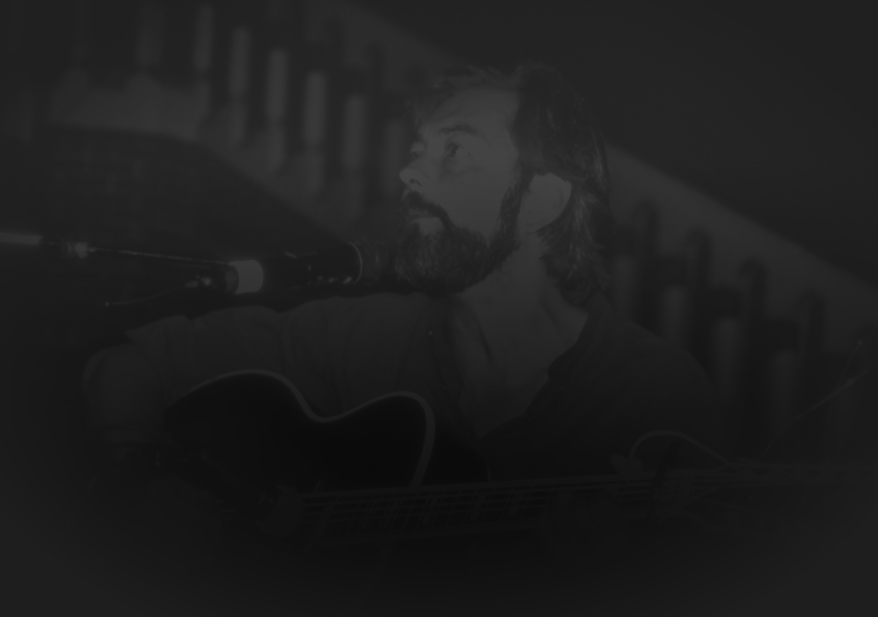 Rich Mullins singing and playing guitar